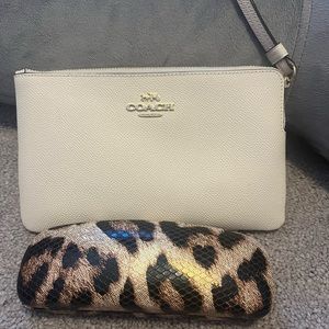 Off white Coach wristlet.